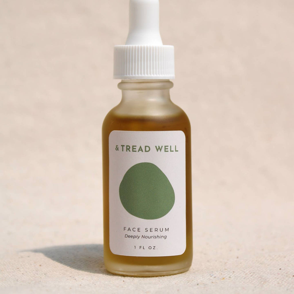 Bottle of Tread Well face serum on a beige background